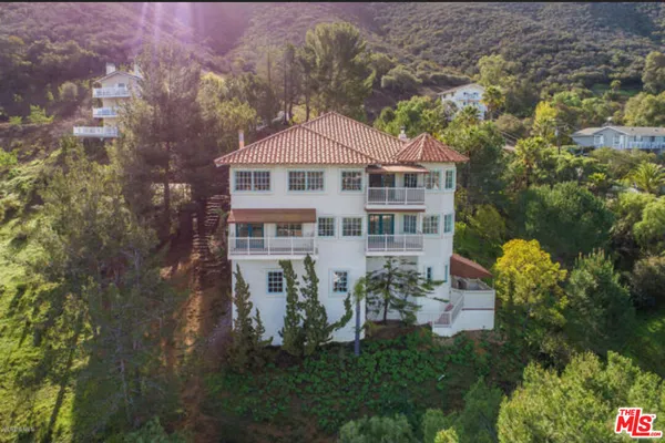 a view of a city with a building in the background