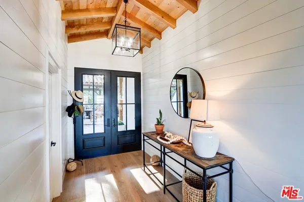 a bedroom with a bed and a lamp