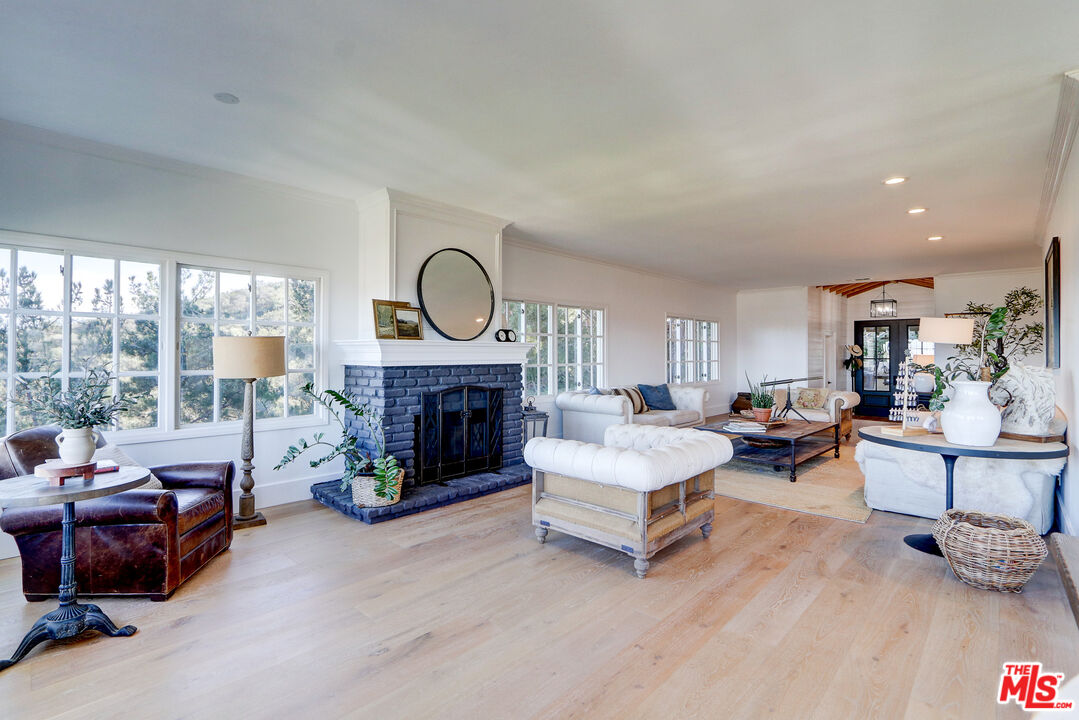 456 McKnight Road Newbury Park, CA 91320 - Photo 34 of 75 a living room with furniture and a fireplace