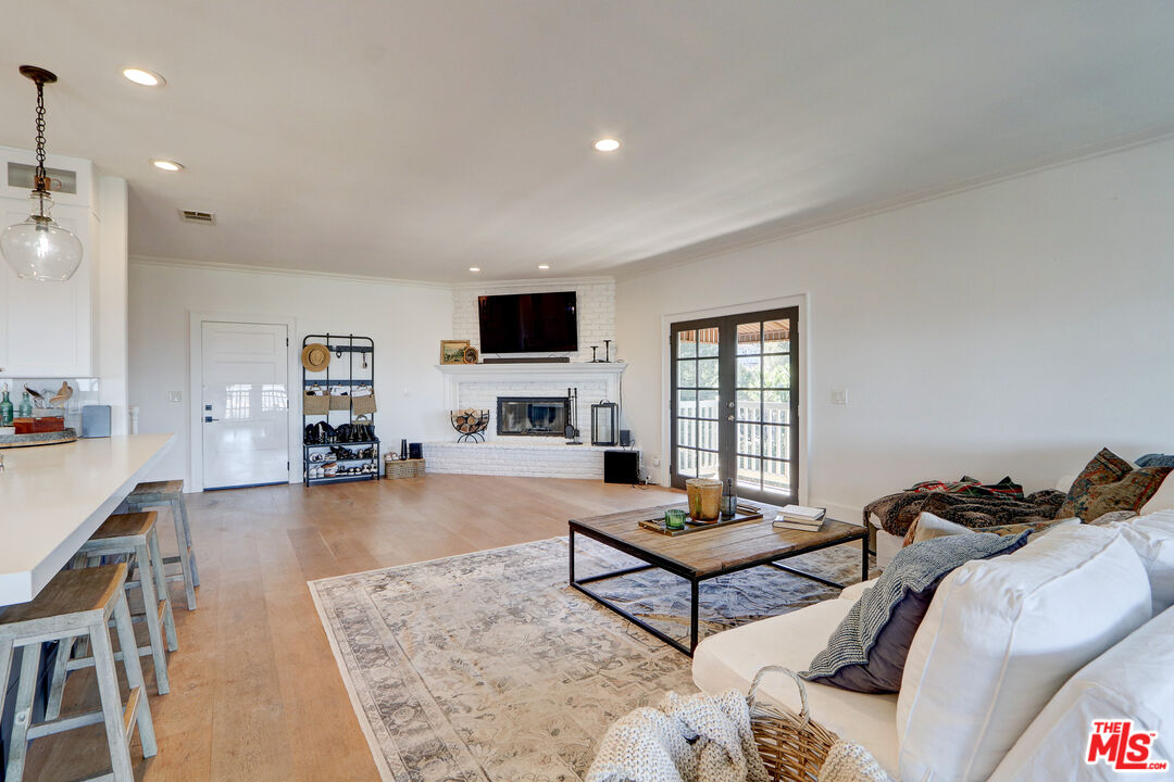 456 McKnight Road Newbury Park, CA 91320 - Photo 43 of 75 a living room with furniture and a flat screen tv