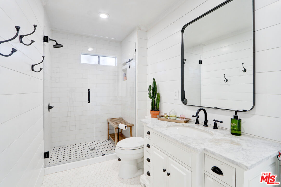 456 McKnight Road Newbury Park, CA 91320 - Photo 54 of 75 a bathroom with a sink double vanity and a shower