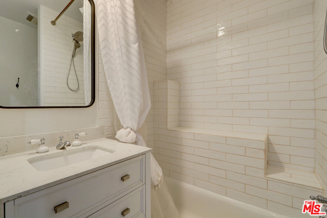 456 McKnight Road Newbury Park, CA 91320 - Photo 69 of 75 a bathroom with a sink and a mirror