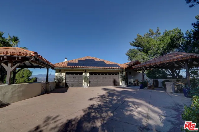 a living room with furniture or wooden floor and a lamp