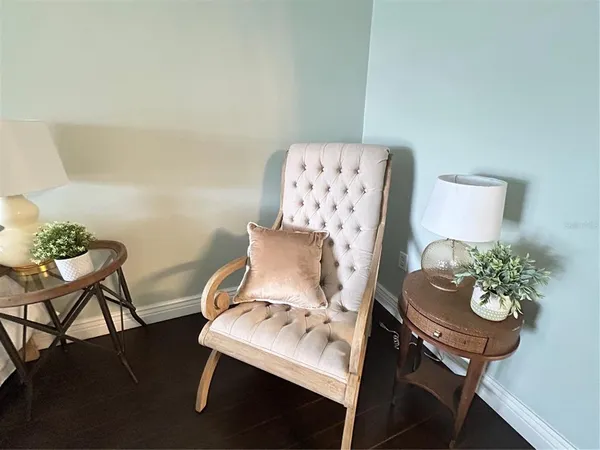 an empty room with wooden floor and a window