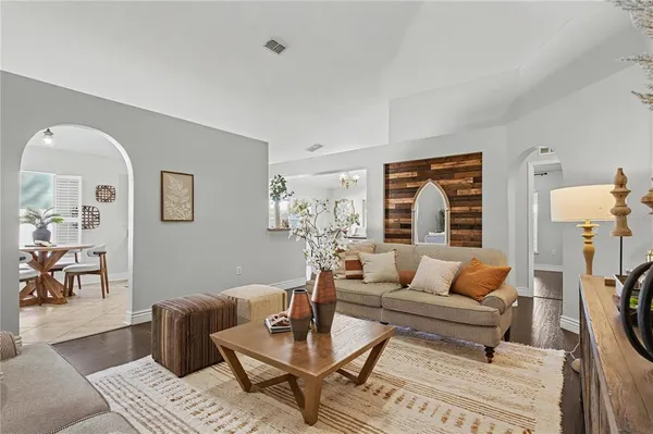 a living room with furniture and a fireplace