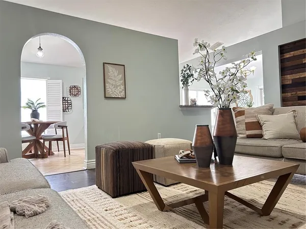 a view of a dining room with furniture and wooden floor