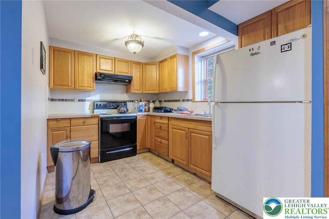 2170 Clearview Road Coplay, PA 18037 - Photo 55 of 75 This cozy kitchen offers functional space with warm cabinetry and ample light.