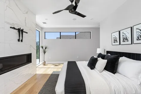 a bedroom with bed and a fireplace