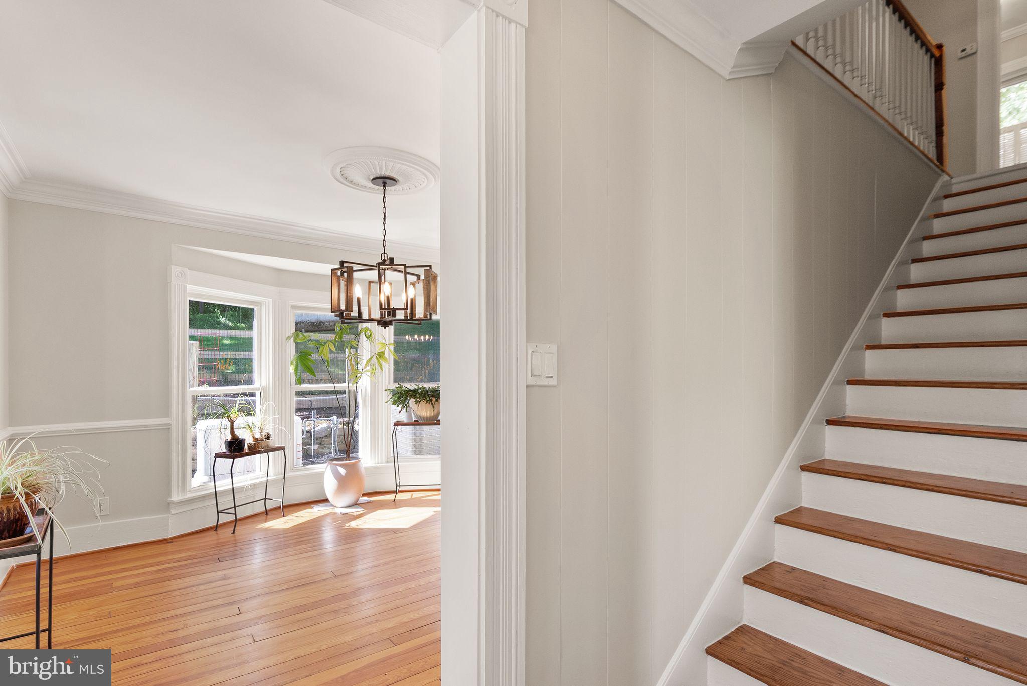 37151 Branchriver Road Purcellville, VA 20132 - Photo 9 of 63 a view of a livingroom with wooden floor and stairs