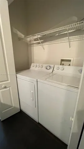 a view of a livingroom with wooden floor