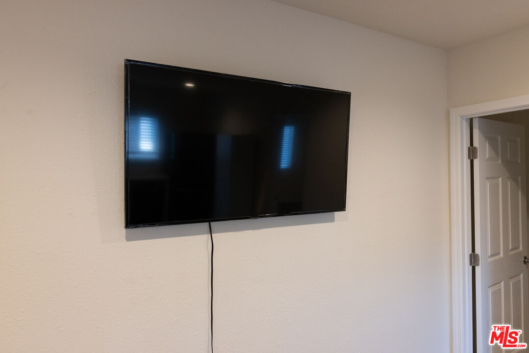 20102 Baltar Street Winnetka, CA 91306 - Photo 16 of 18 a bathroom with a shower and a sink