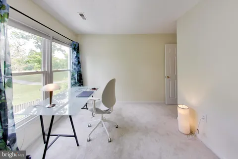 a workspace with furniture and a window