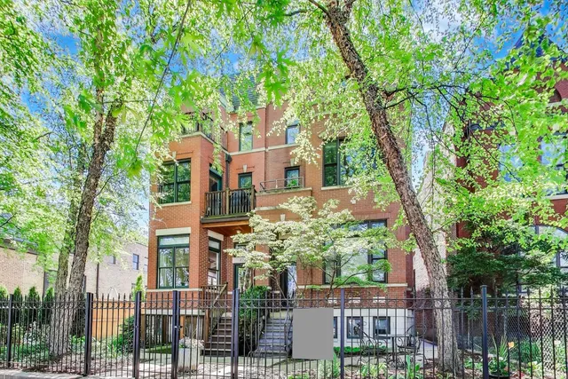 front view of a house with a tree