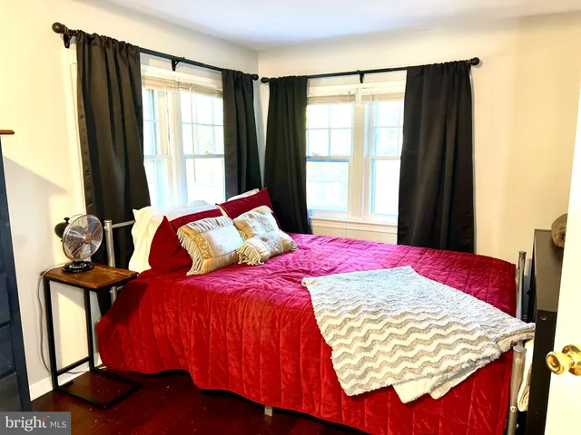 a bedroom with a bed and window