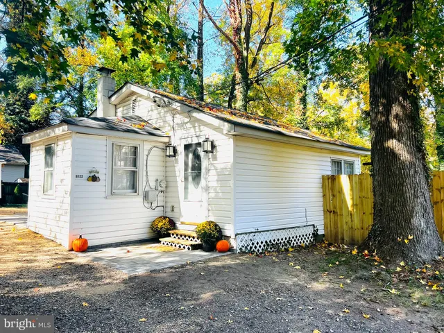 a view of a house with a tree
