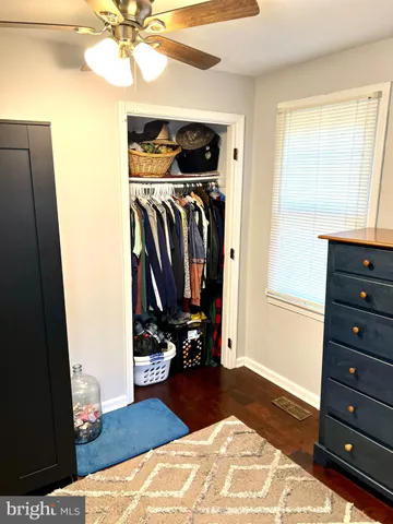 a bedroom with a bed and a mirror