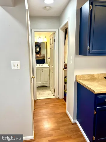 a view of a kitchen from the hallway