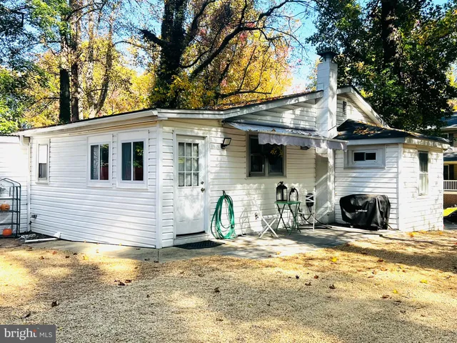 a view of a house with snow on the background