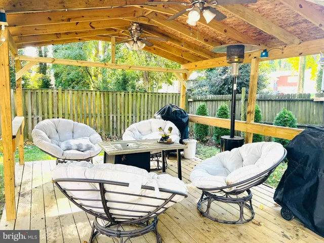 a view of a patio with a dining table and chairs