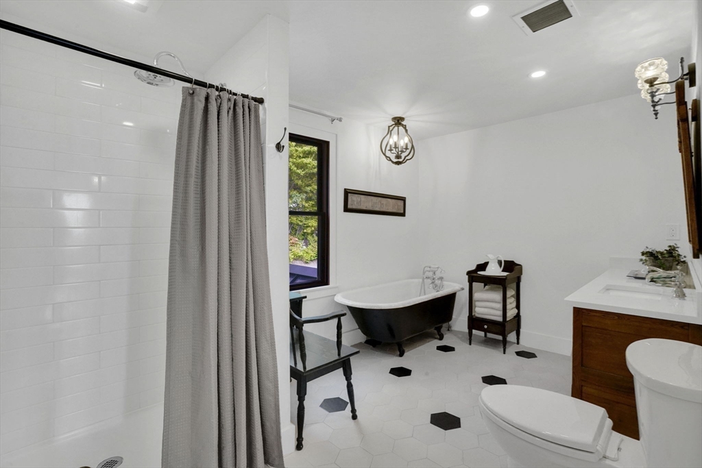 58 N Road Montgomery, MA 01085 - Photo 29 of 42 a bathroom with a sink mirror and toilet