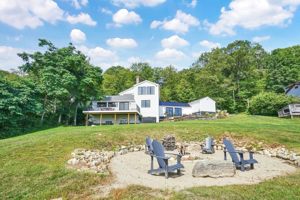 58 N Road Montgomery, MA 01085 - Photo 5 of 42 a view of a house with backyard and sitting area