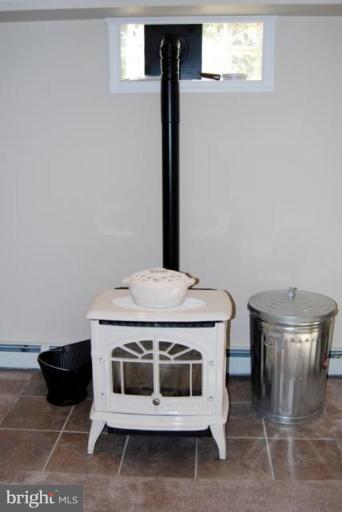 2519 Cool Spring Road Bel Air, MD 21015 - Photo 27 of 30 pellet stove in basement