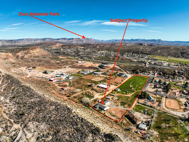 422 West Buckeye Reef Road Leeds, UT 84746 - Photo 9 of 47 Aerial view of property's location featuring a mountain backdrop and property parcel outlined