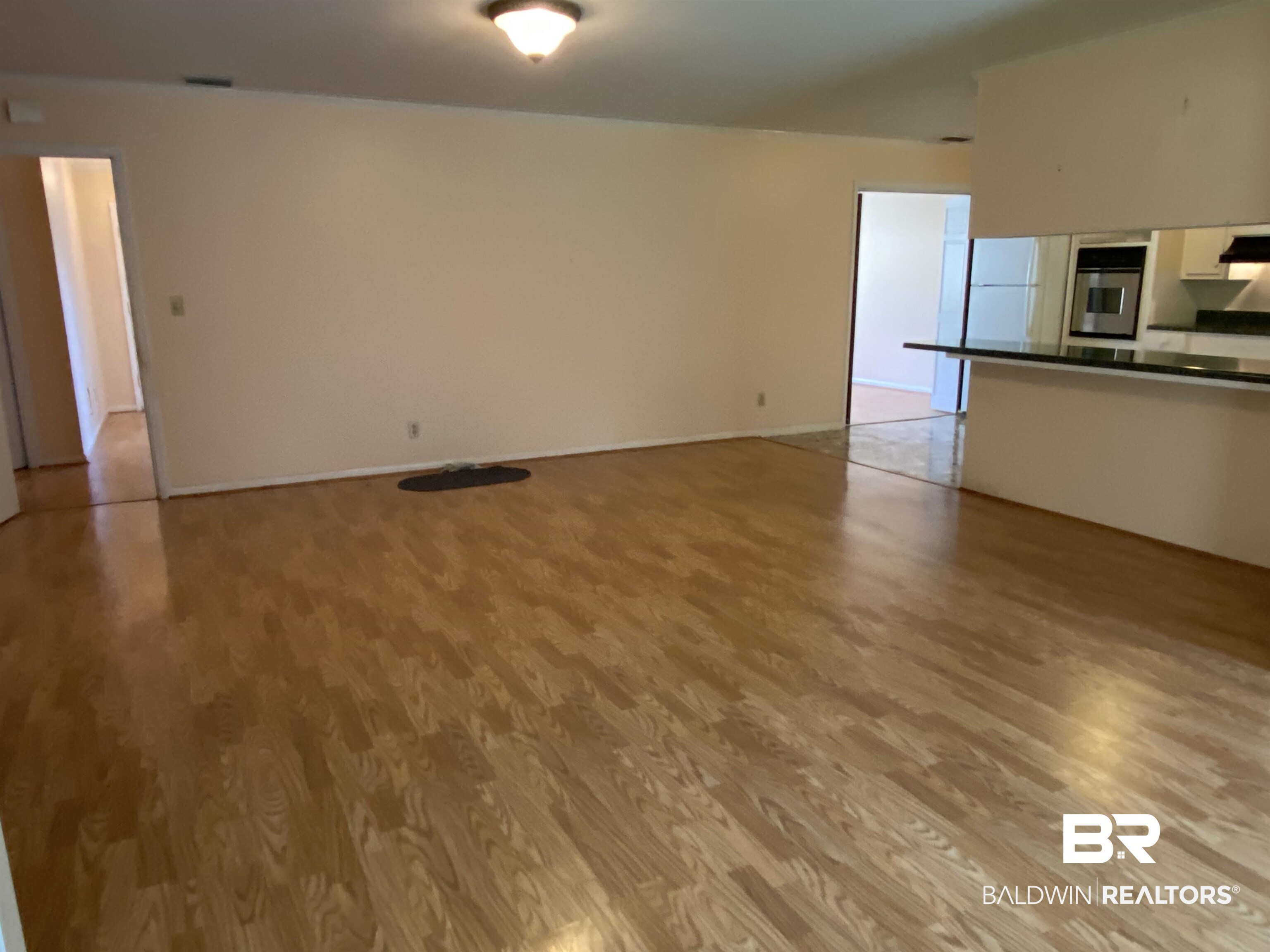 106 Terry Drive Brewton, AL 36426 - Photo 12 of 25 Unfurnished Den featuring light wood finished floors and baseboards