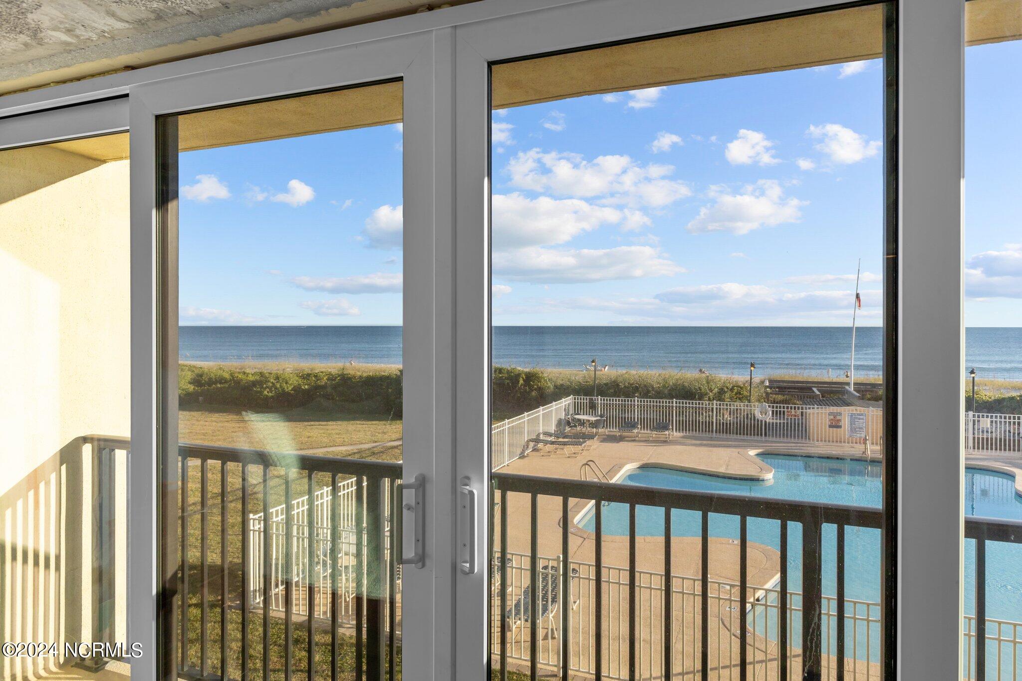 2305 West Fort Macon Road, Unit 206 Atlantic Beach, NC 28512 - Photo 21 of 48 Primary Bedroom w/ Walkout Balcony