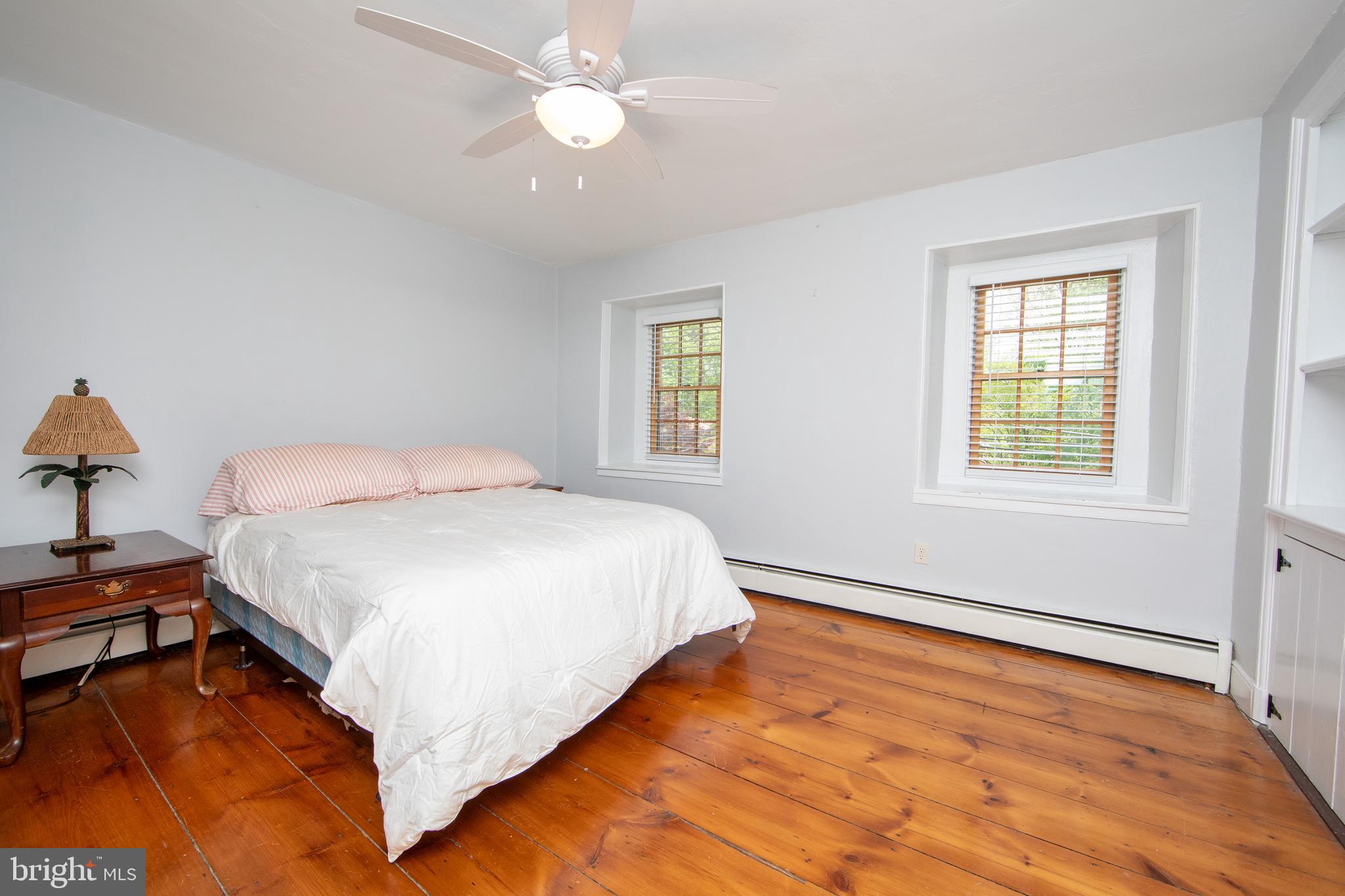 2957 River Road New Hope, PA 18938 - Photo 11 of 30 a spacious bedroom with a bed and a window