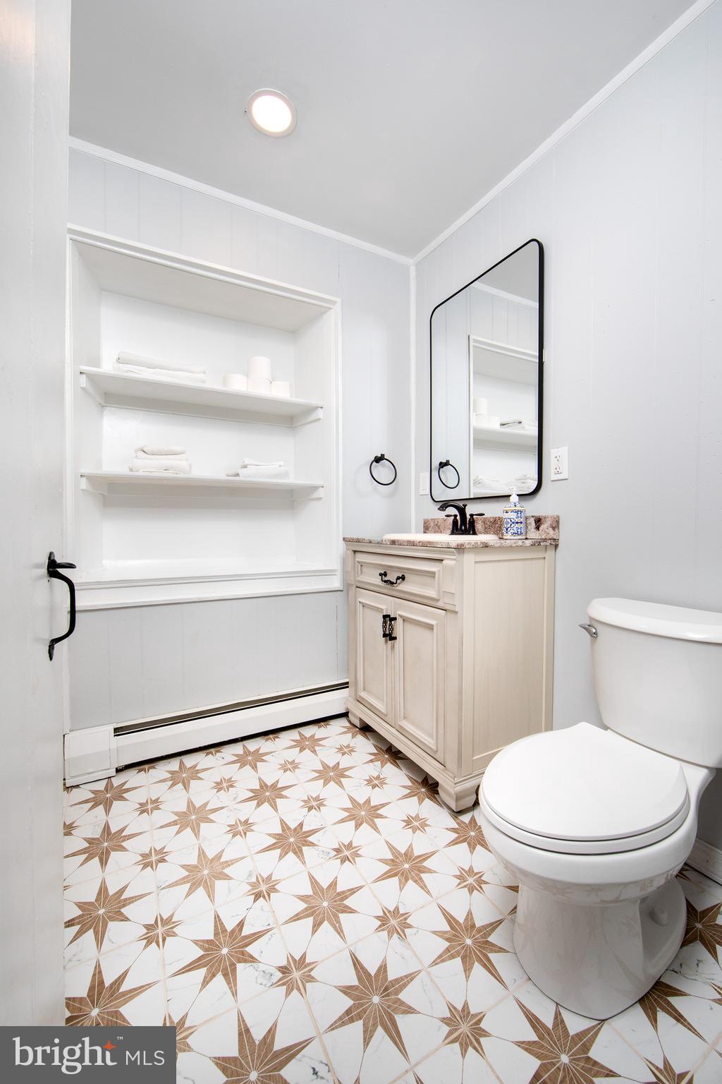 2957 River Road New Hope, PA 18938 - Photo 16 of 30 a bathroom with a toilet a sink and a mirror