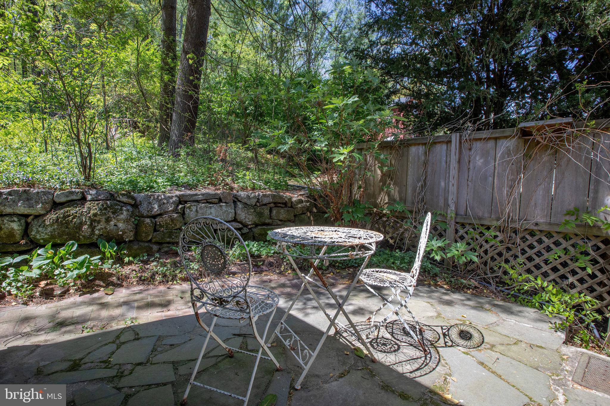 2957 River Road New Hope, PA 18938 - Photo 22 of 30 a view of chair and table in backyard with wooden fence