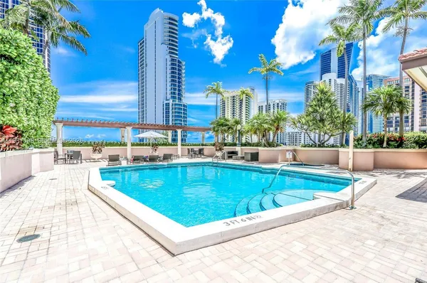 a view of a swimming pool with a patio