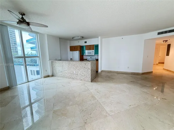 a view of room with floor to ceiling window