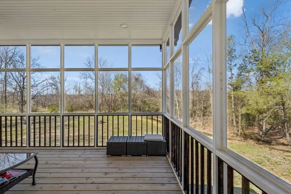 a view of balcony with furniture