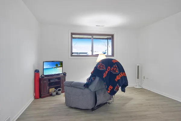 a living room with furniture a couch and a window