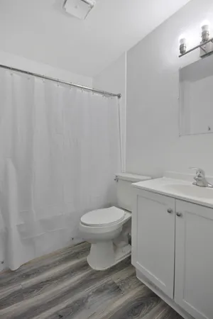 a bathroom with a toilet and a sink
