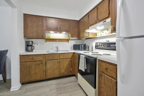 a kitchen with stainless steel appliances granite countertop a sink and cabinets
