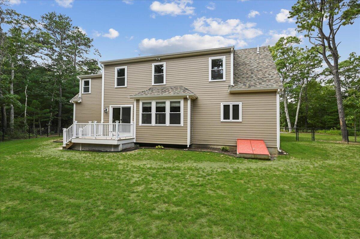 275 Cotuit Road Mashpee, MA 02649 - Photo 3 of 47 a view of a house with a backyard