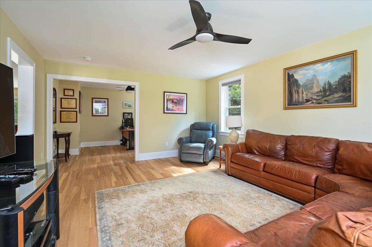 275 Cotuit Road Mashpee, MA 02649 - Photo 8 of 47 a living room with furniture and a flat screen tv