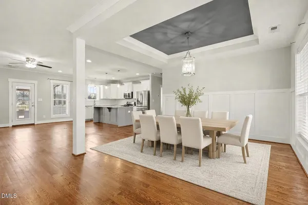 a view of kitchen with furniture and wooden floor