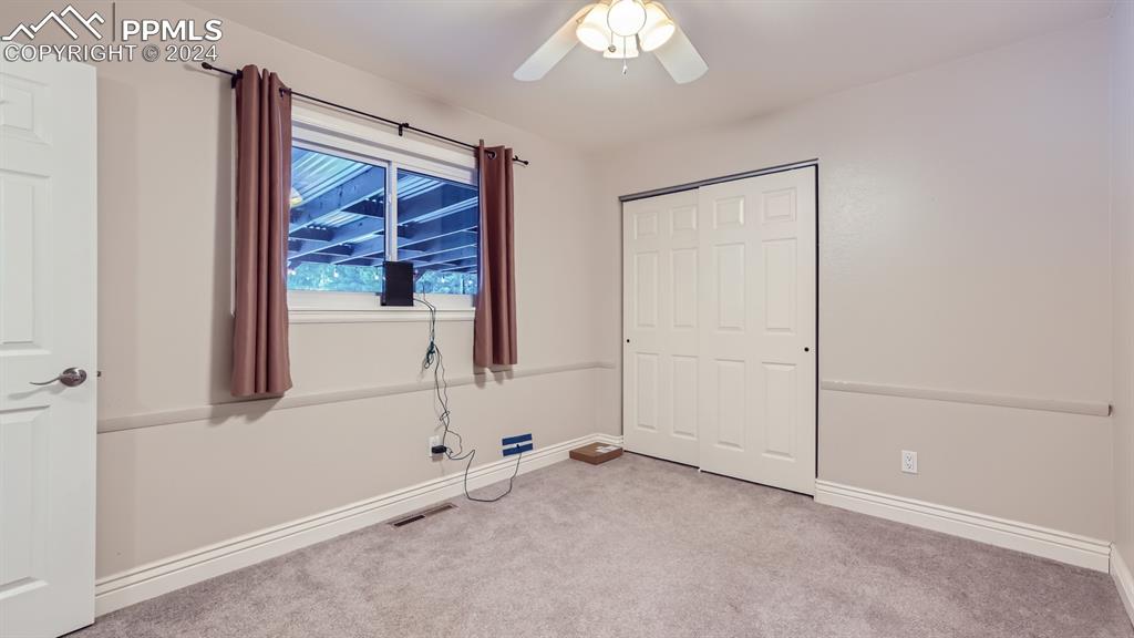 16635 High Tree Drive Elbert, CO 80106 - Photo 18 of 44 an empty room with windows