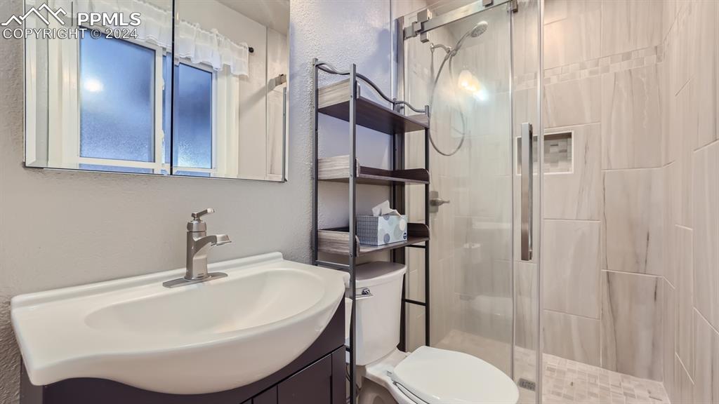 16635 High Tree Drive Elbert, CO 80106 - Photo 20 of 44 a bathroom with a sink toilet and shower