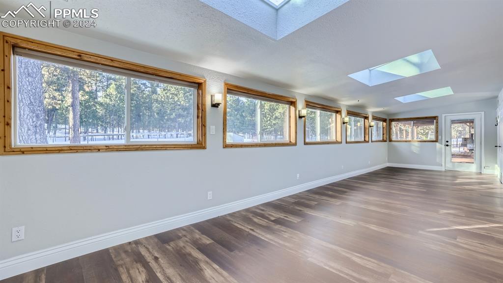 16635 High Tree Drive Elbert, CO 80106 - Photo 28 of 44 a view of an empty room with wooden floor and a window