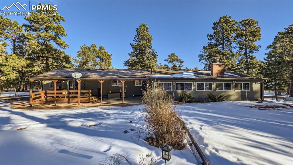 16635 High Tree Drive Elbert, CO 80106 - Photo 36 of 44 a front view of a house with garden