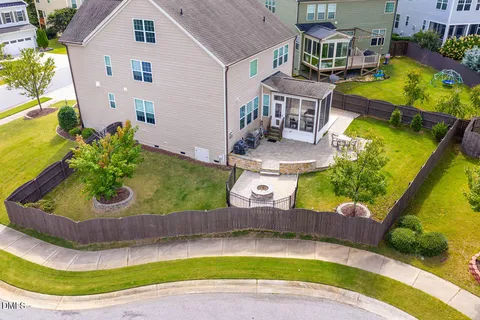 an aerial view of a house with a swimming pool