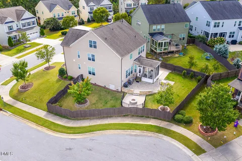 an aerial view of a house with a swimming pool