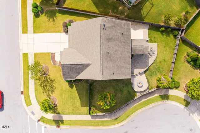 a kitchen with kitchen island granite countertop a sink cabinets and window