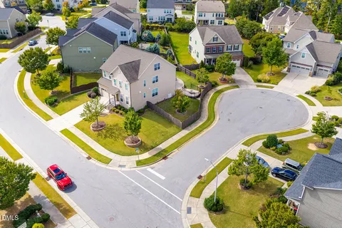 an aerial view of a house with swimming pool