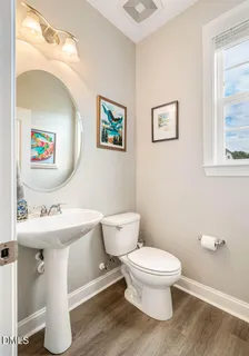 a kitchen with stainless steel appliances granite countertop a sink a stove and cabinets